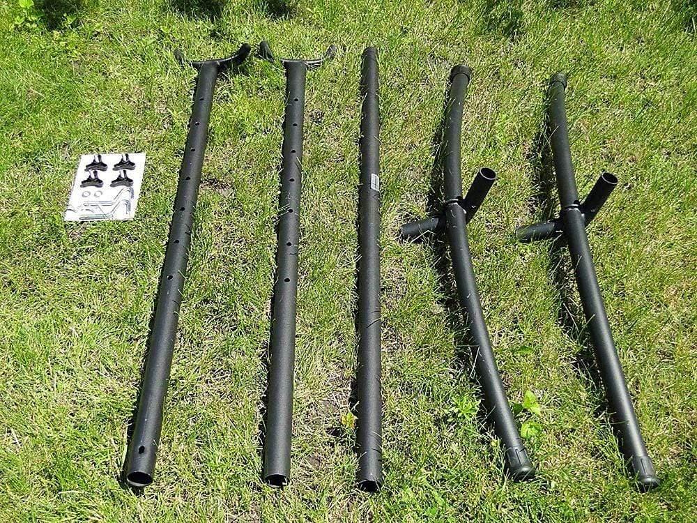 Universal hammock stand parts and hardware laid out on green grass outdoor setting
