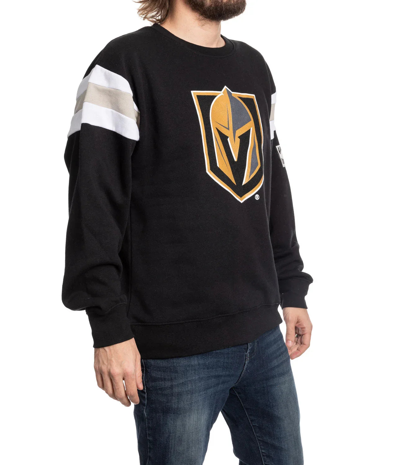 Man wearing black Vegas Golden Knights varsity sweater with gold logo and striped sleeves