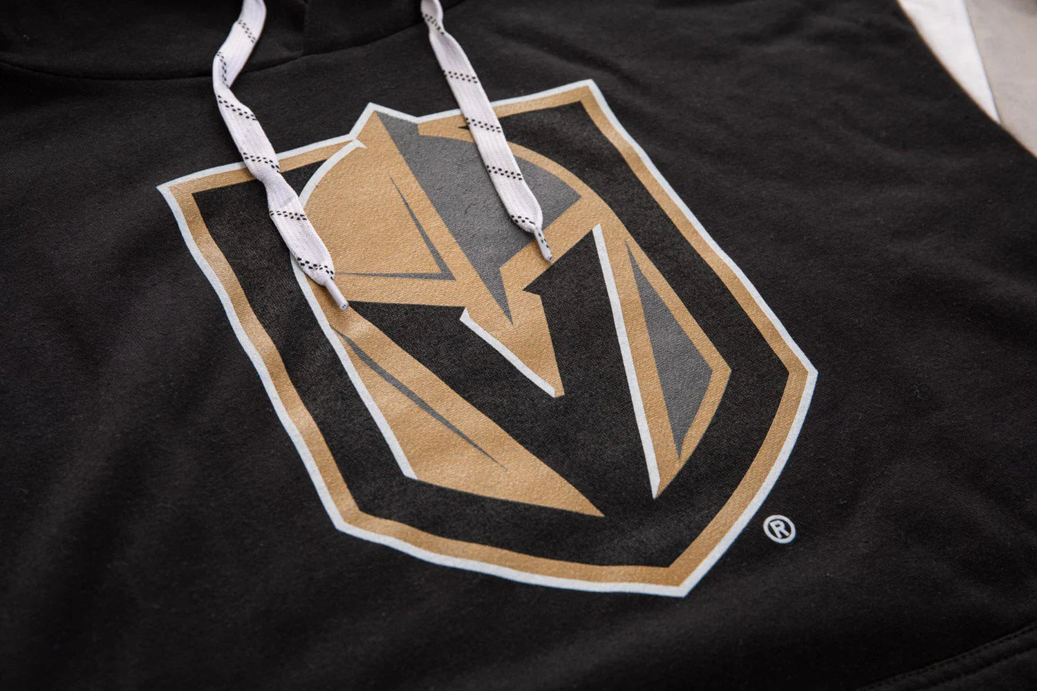 Vegas Golden Knights black hoodie with gold and gray shield logo and white drawstrings
