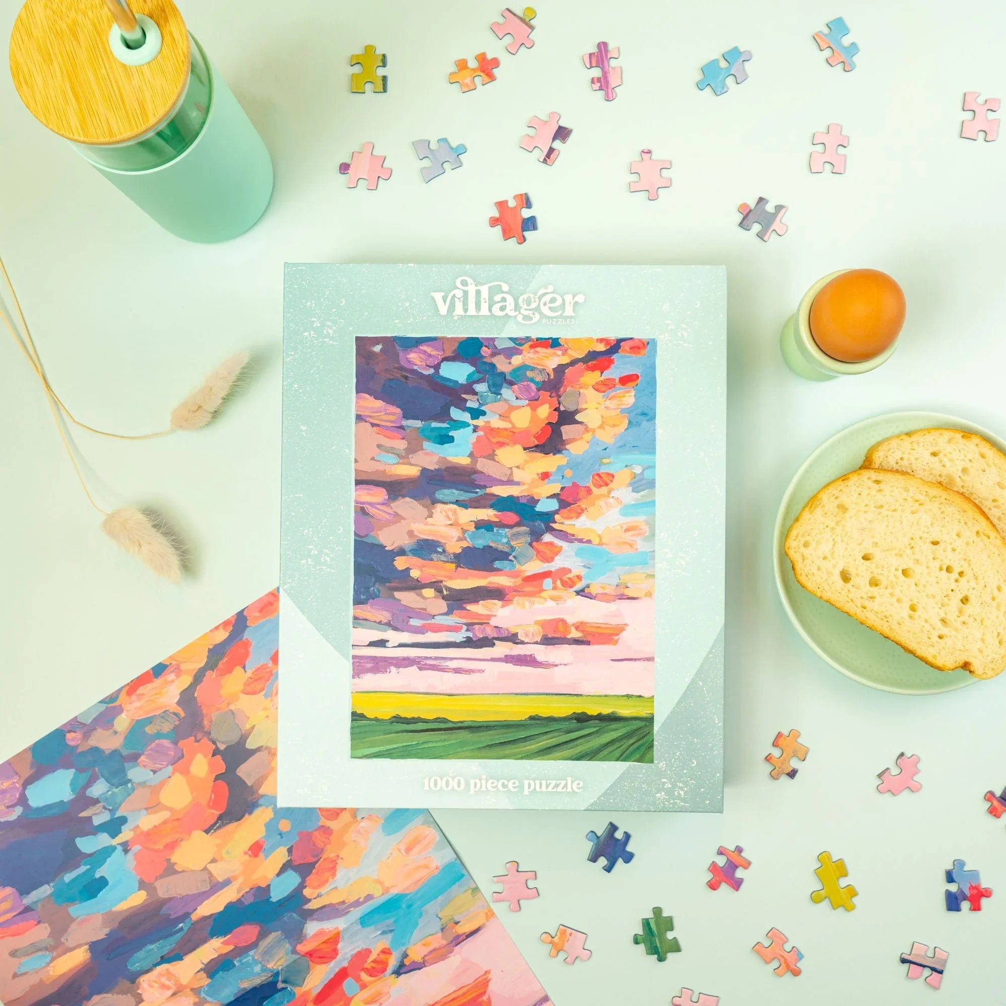 Villager 1000 piece Prairie Sky puzzle box with colorful sky art, bread, and scattered puzzle pieces