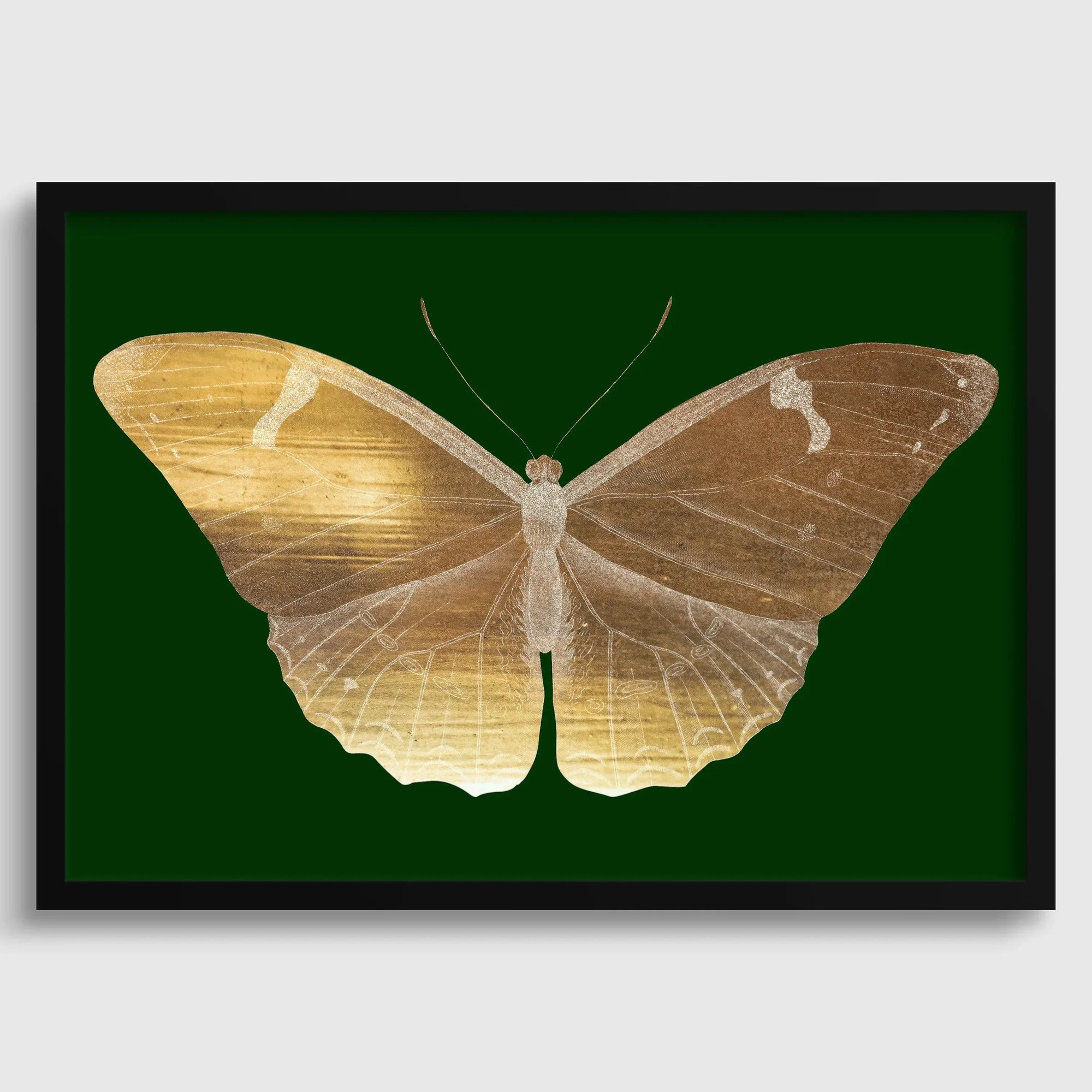 Vintage gold butterfly art print on emerald green background, framed dark academia style