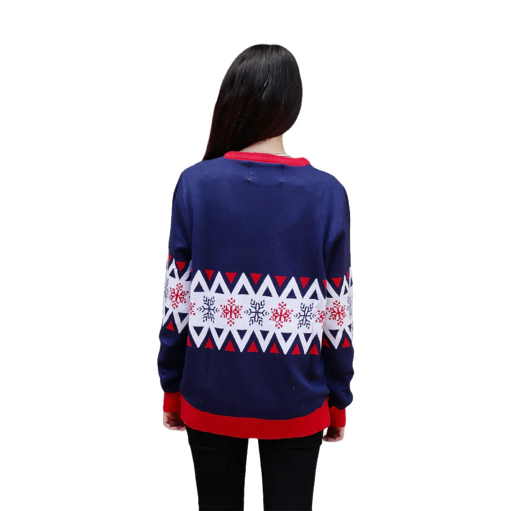 Back view of woman wearing navy blue Christmas sweater with red snowflake pattern