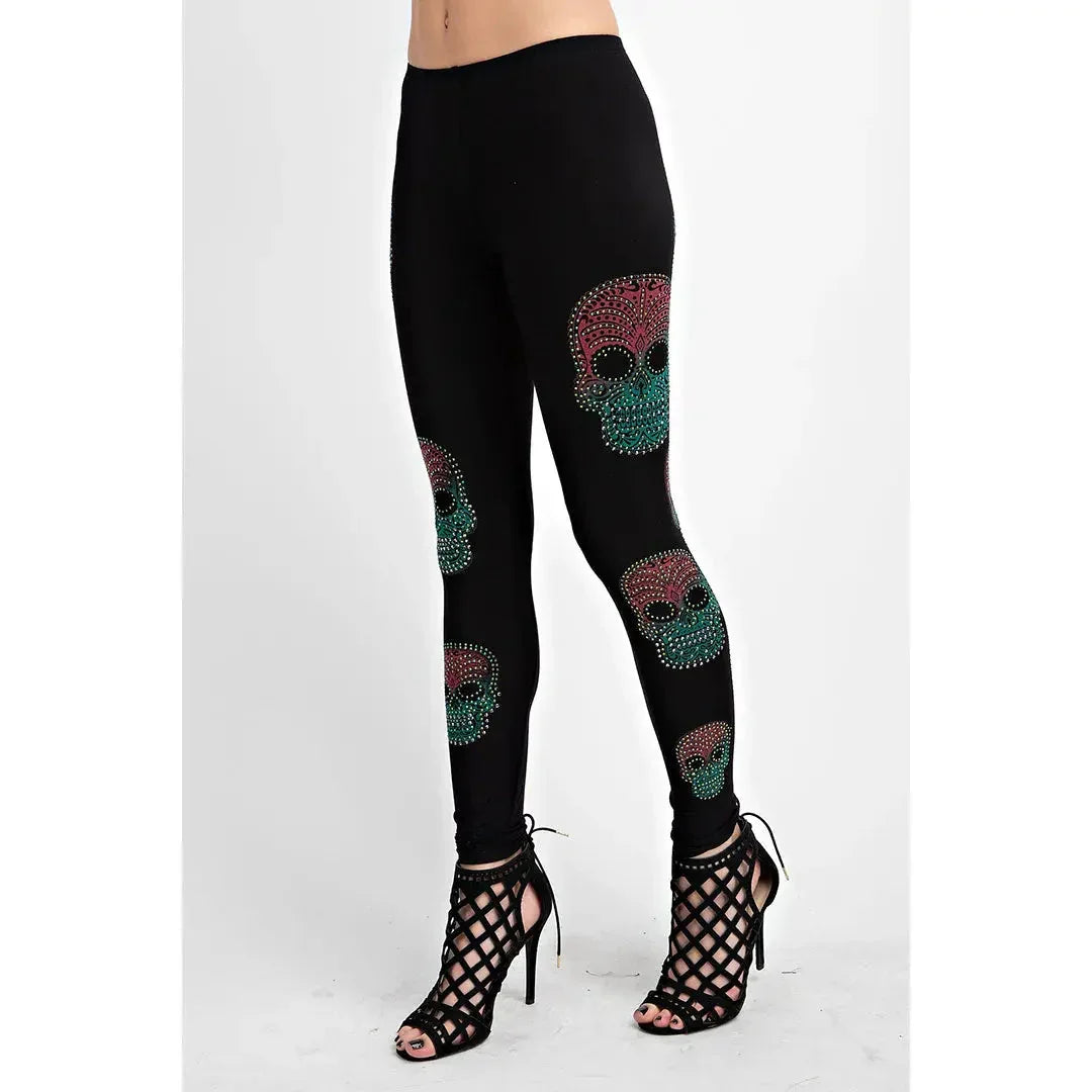 Black women's leggings with colorful sugar skull design, paired with high heel sandals