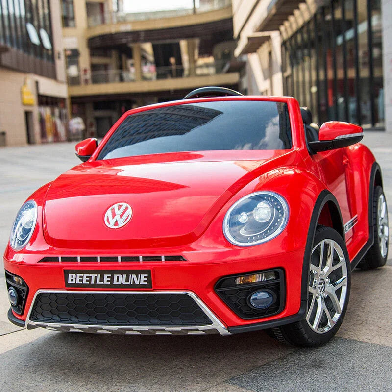 Red Volkswagen Beetle Dune kids ride-on car on city street, toy vehicle for children