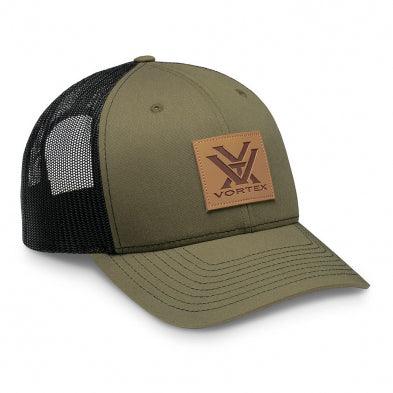 Olive green Vortex trucker hat with black mesh back and leather logo patch on front