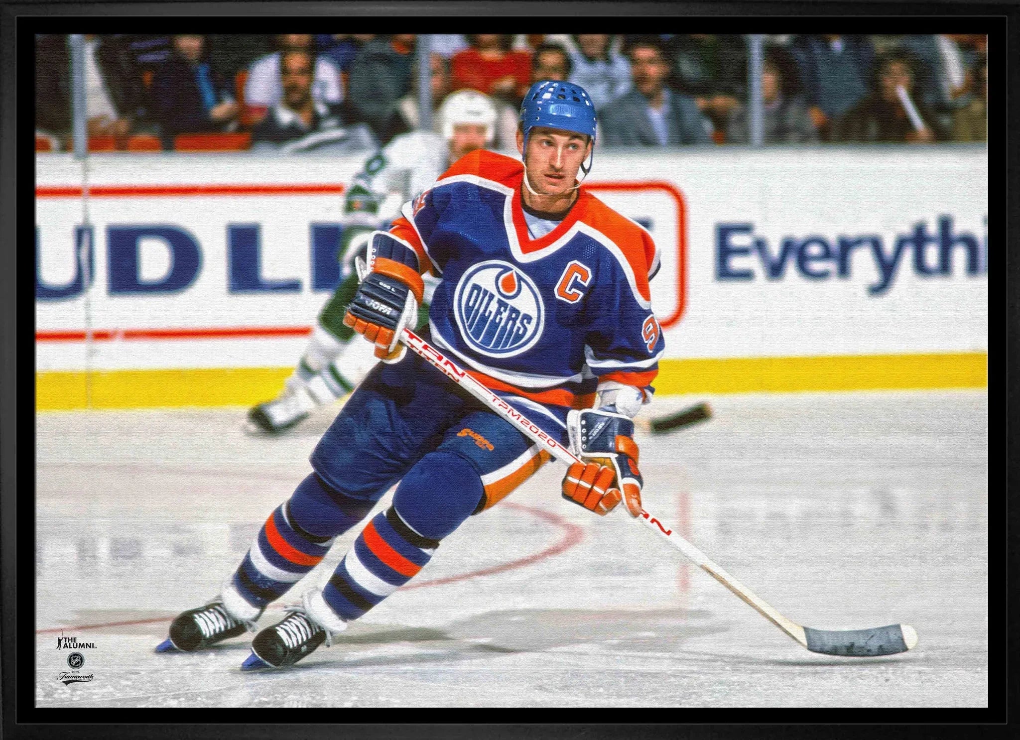 Edmonton Oilers hockey player in blue jersey and helmet skating on ice during a game