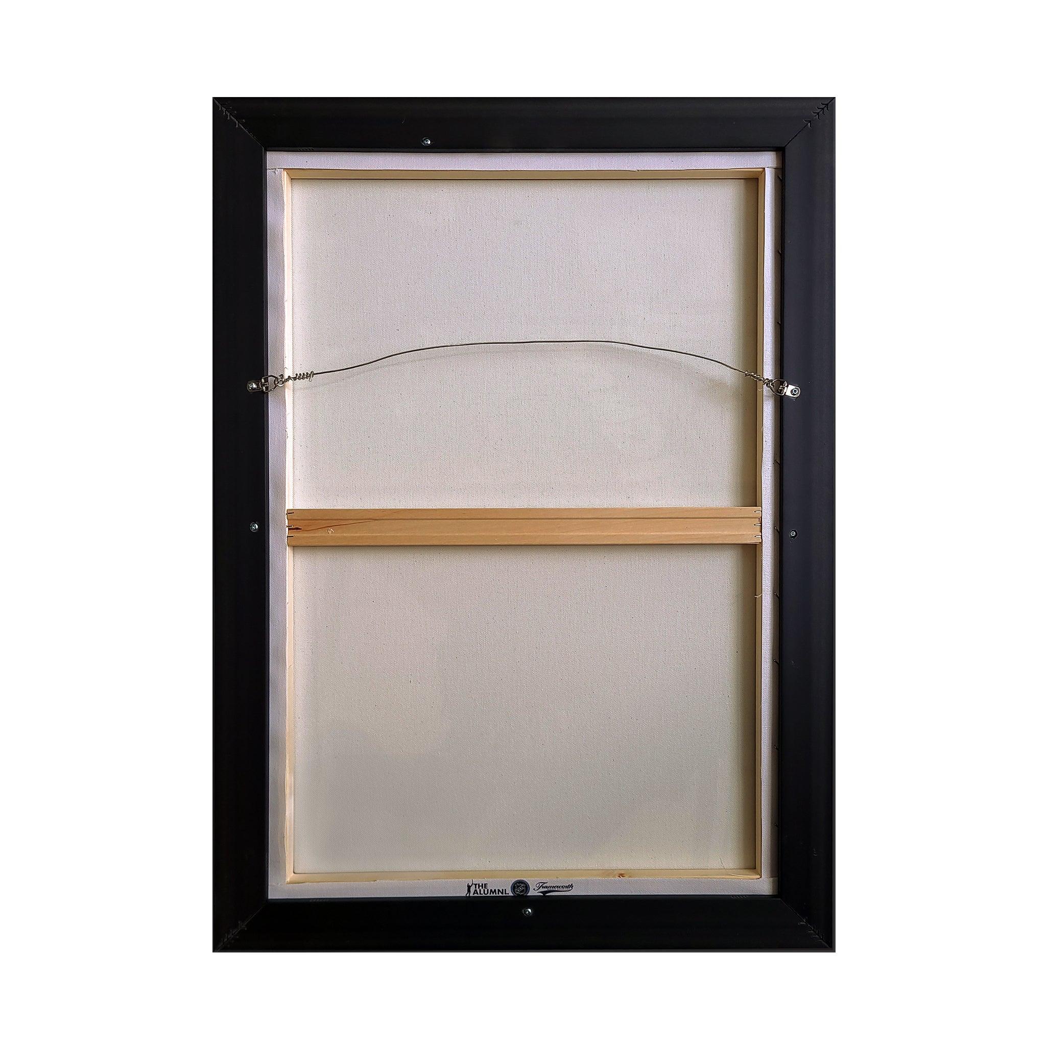 Back of framed canvas art with hanging wire, wooden stretcher bar, and black frame
