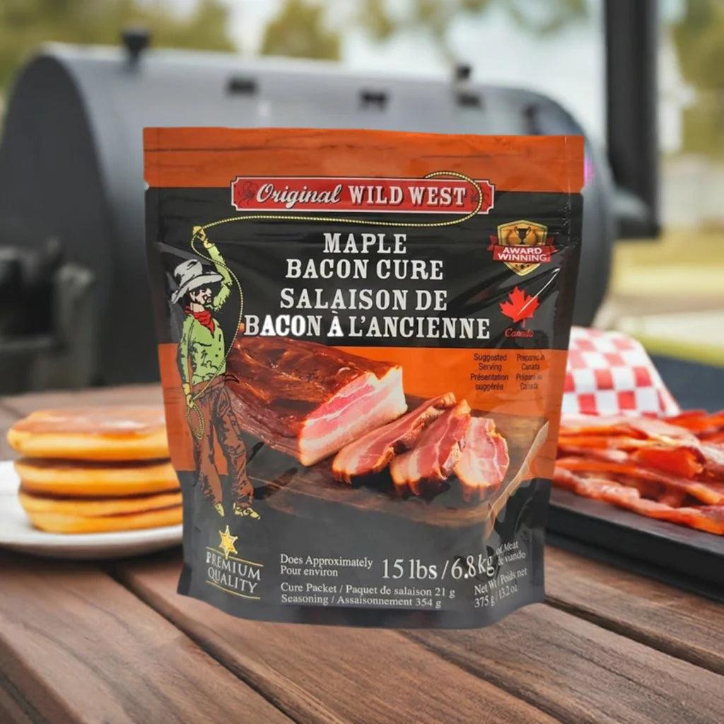 Original Wild West maple bacon cure bag on outdoor table with pancakes and bacon, grill in background