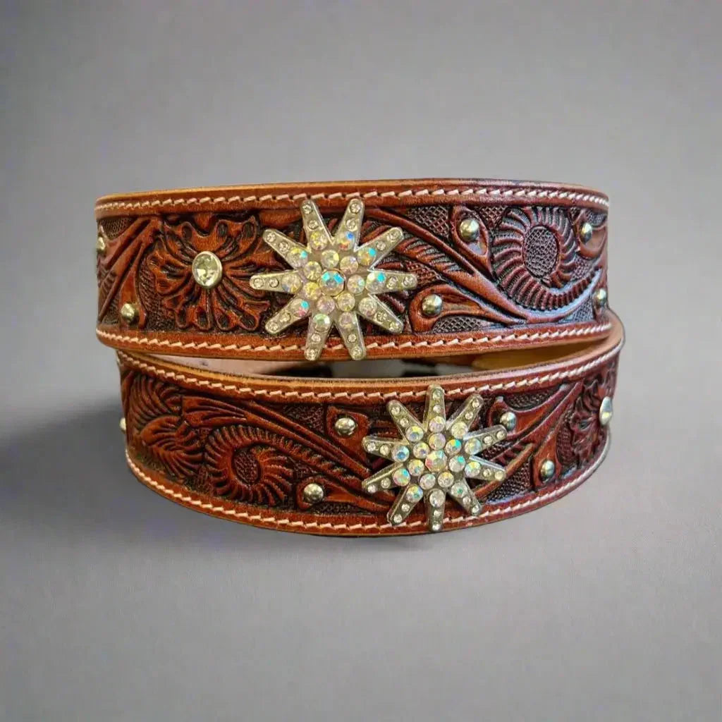 Embossed western leather belt with rhinestone bling star accents for women, brown background