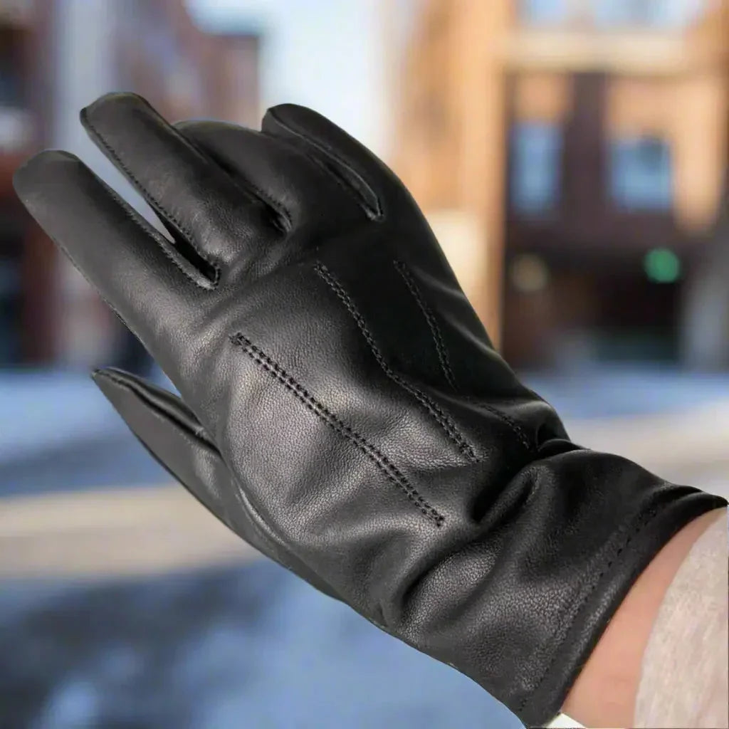 Women's genuine black leather glove with stitching detail outdoors