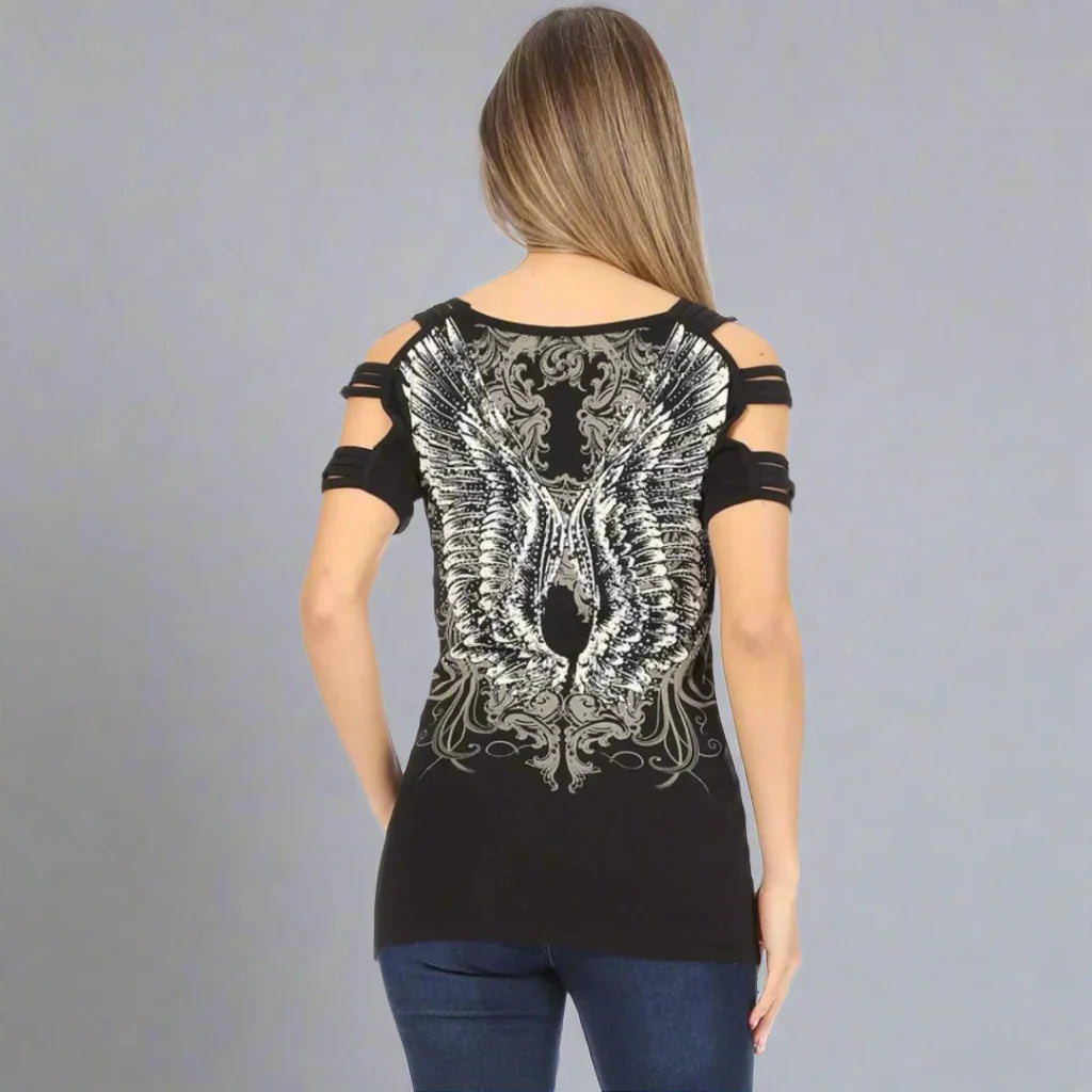 Woman wearing black cold shoulder top with silver angel wing graphic on the back