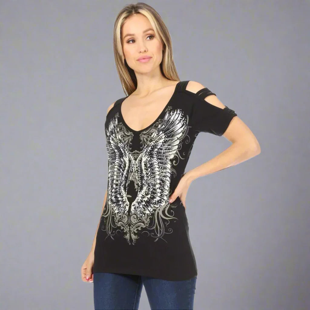 Woman wearing black cold shoulder t-shirt with silver angel wings graphic on front