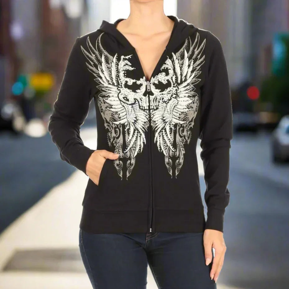 Woman wearing black zip-up hoodie with white phoenix graphic, urban background