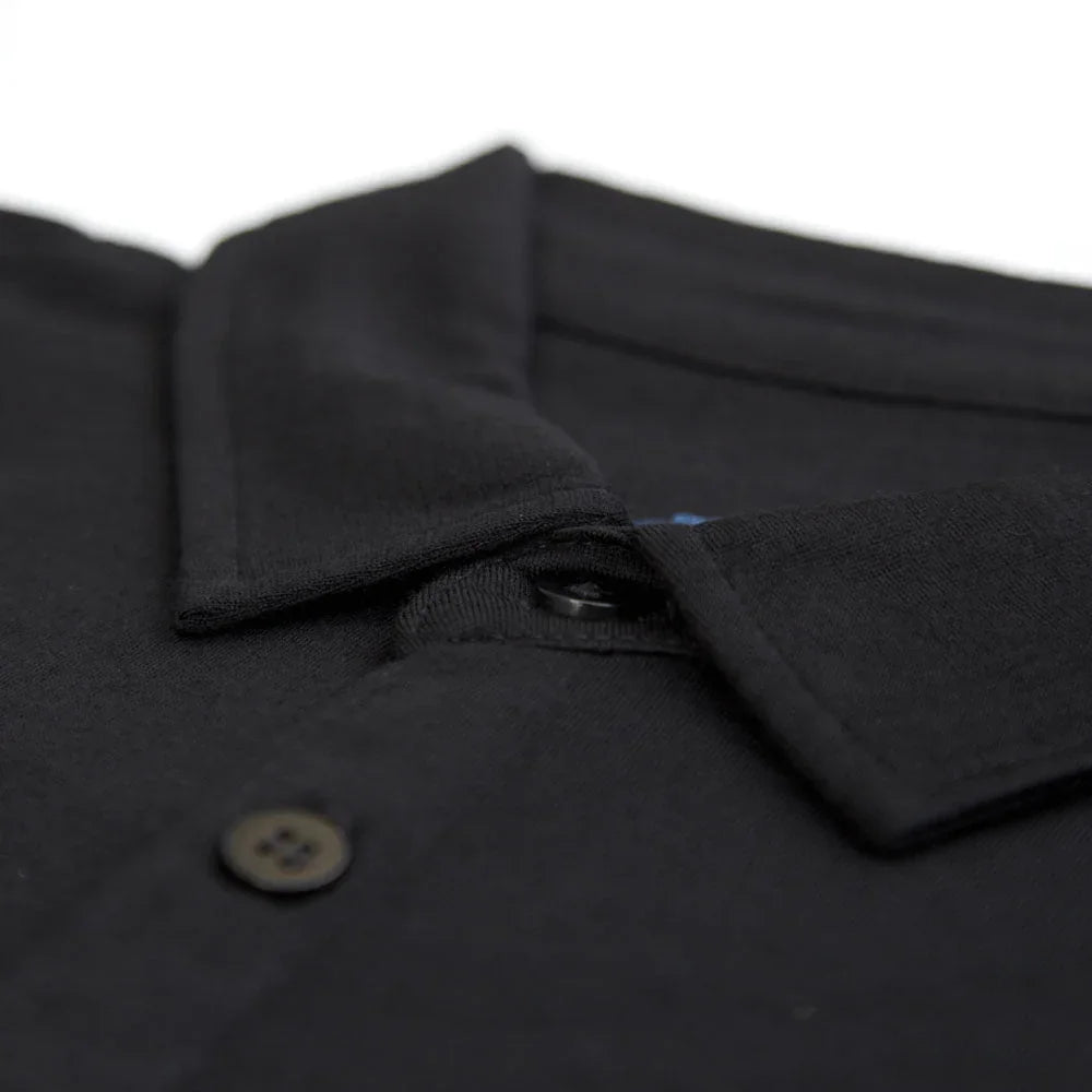 Close-up of black merino wool men's golf shirt collar with button and pocket