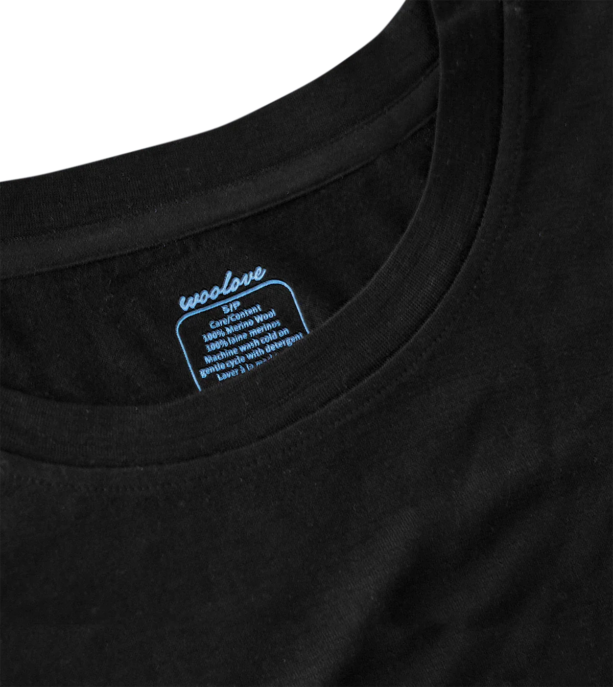 Close-up of black men's 100% merino wool short sleeve t-shirt collar and tag