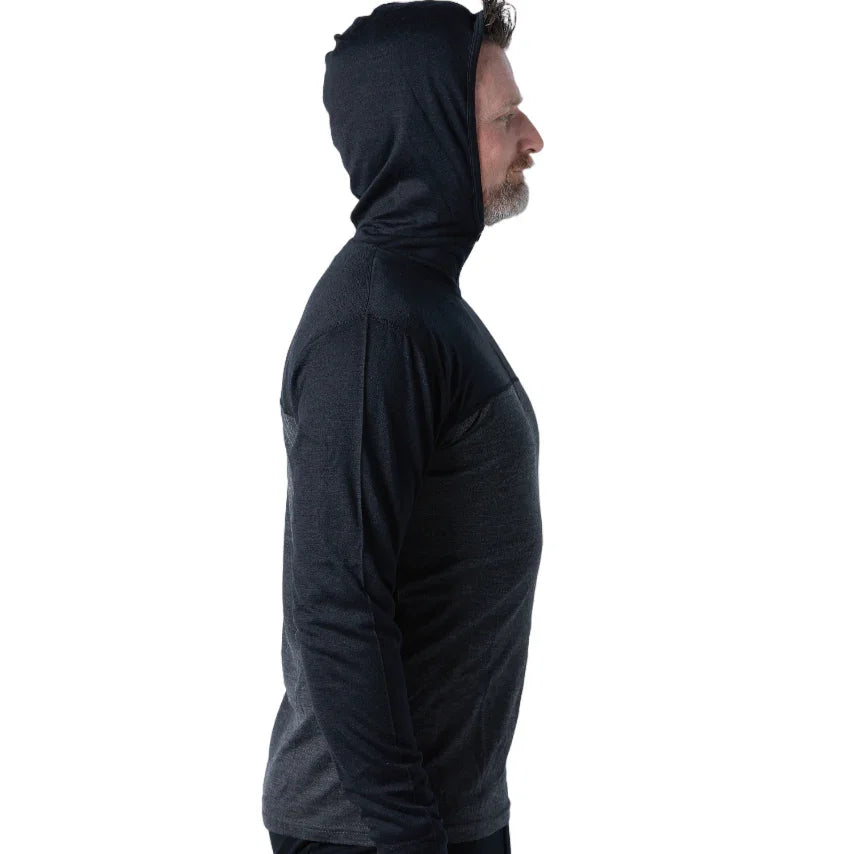 Man wearing dark merino wool quarter zip hoodie, side view, white background