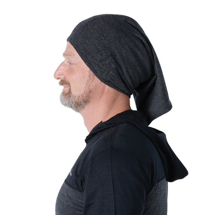 Man in profile wearing a dark gray hooded shirt with attached hood, white background