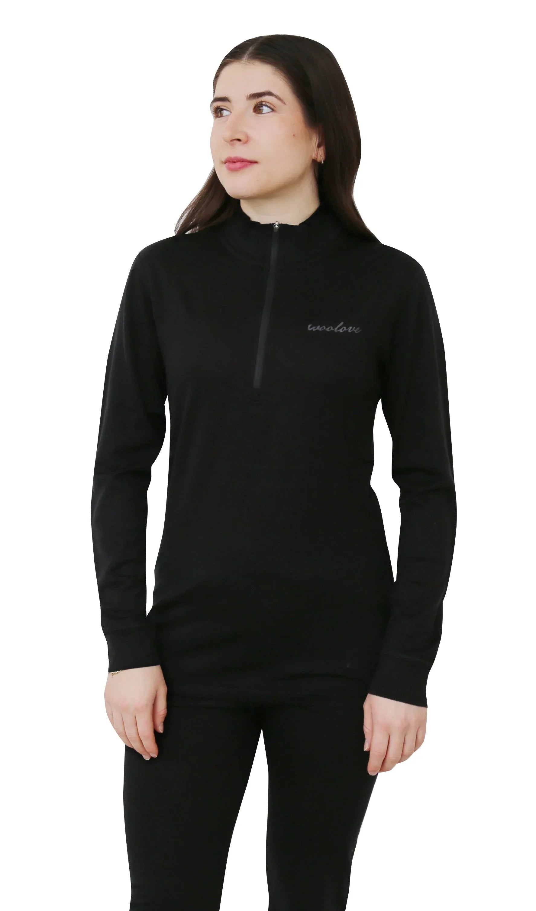 Woman wearing black 100% merino wool 1/4 zip pullover and leggings on white background