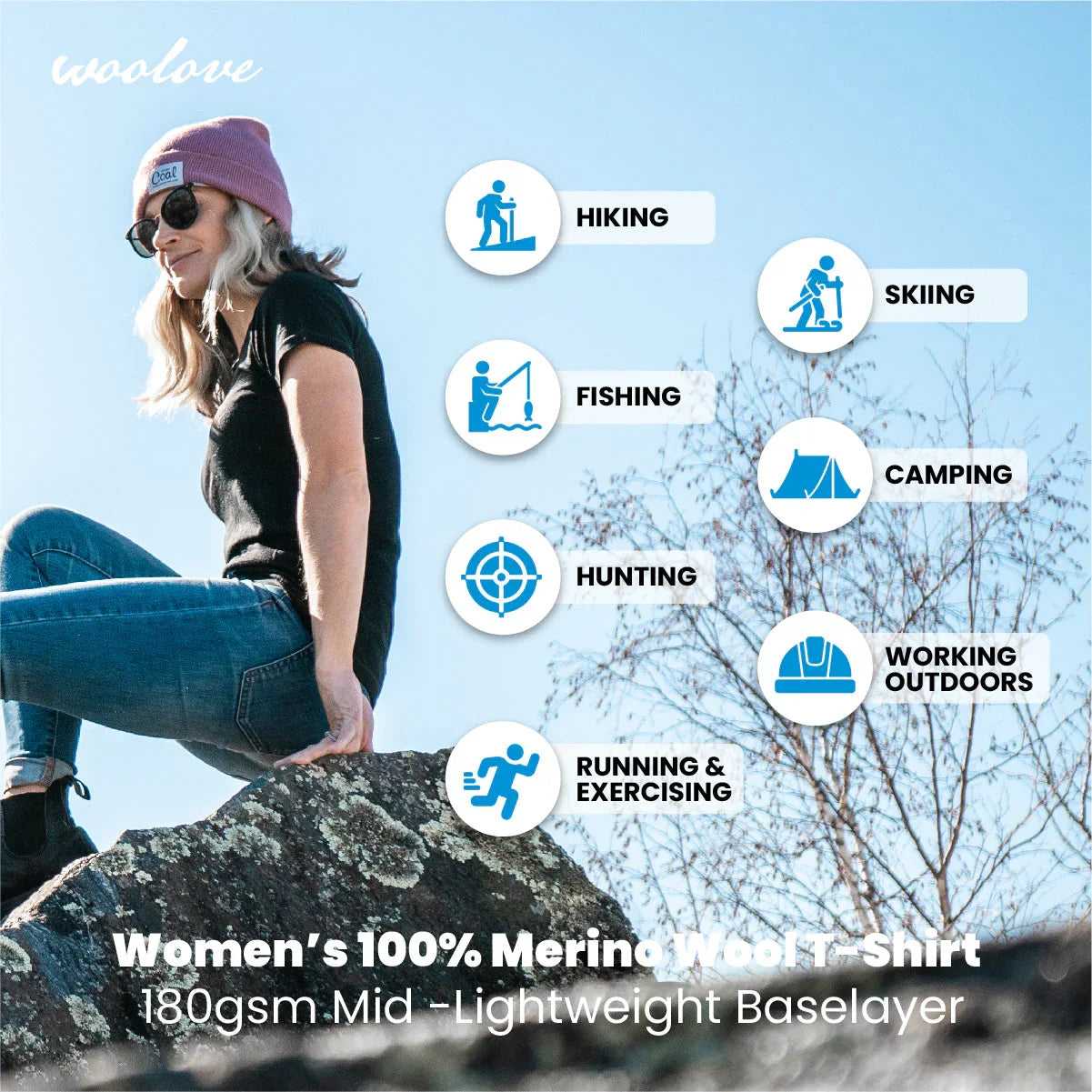 Woman in black t-shirt outdoors on rock, promoting merino wool shirt for hiking and activities