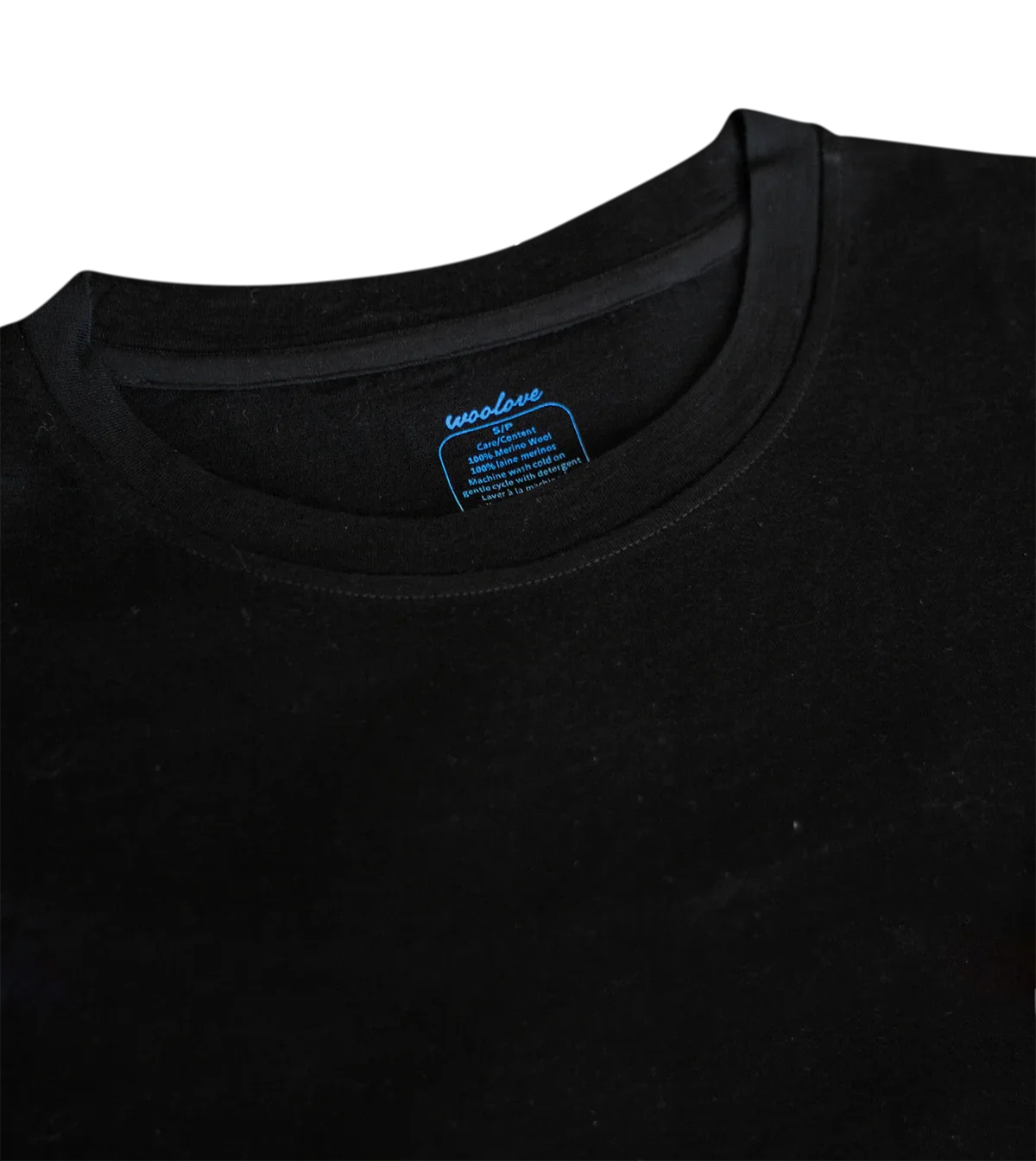 Woolove women's black merino wool t-shirt collar with blue care label