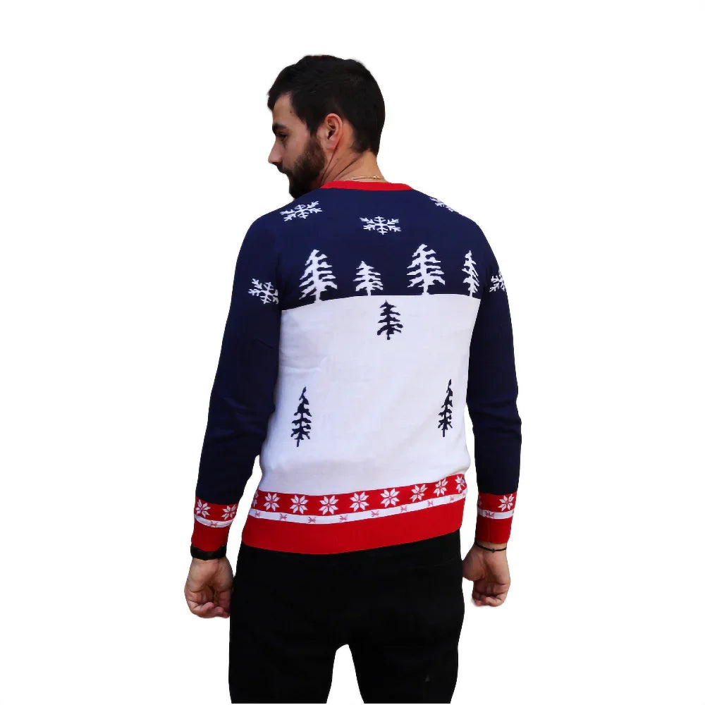Man wearing navy blue and white Christmas sweater with snowflakes and pine tree patterns