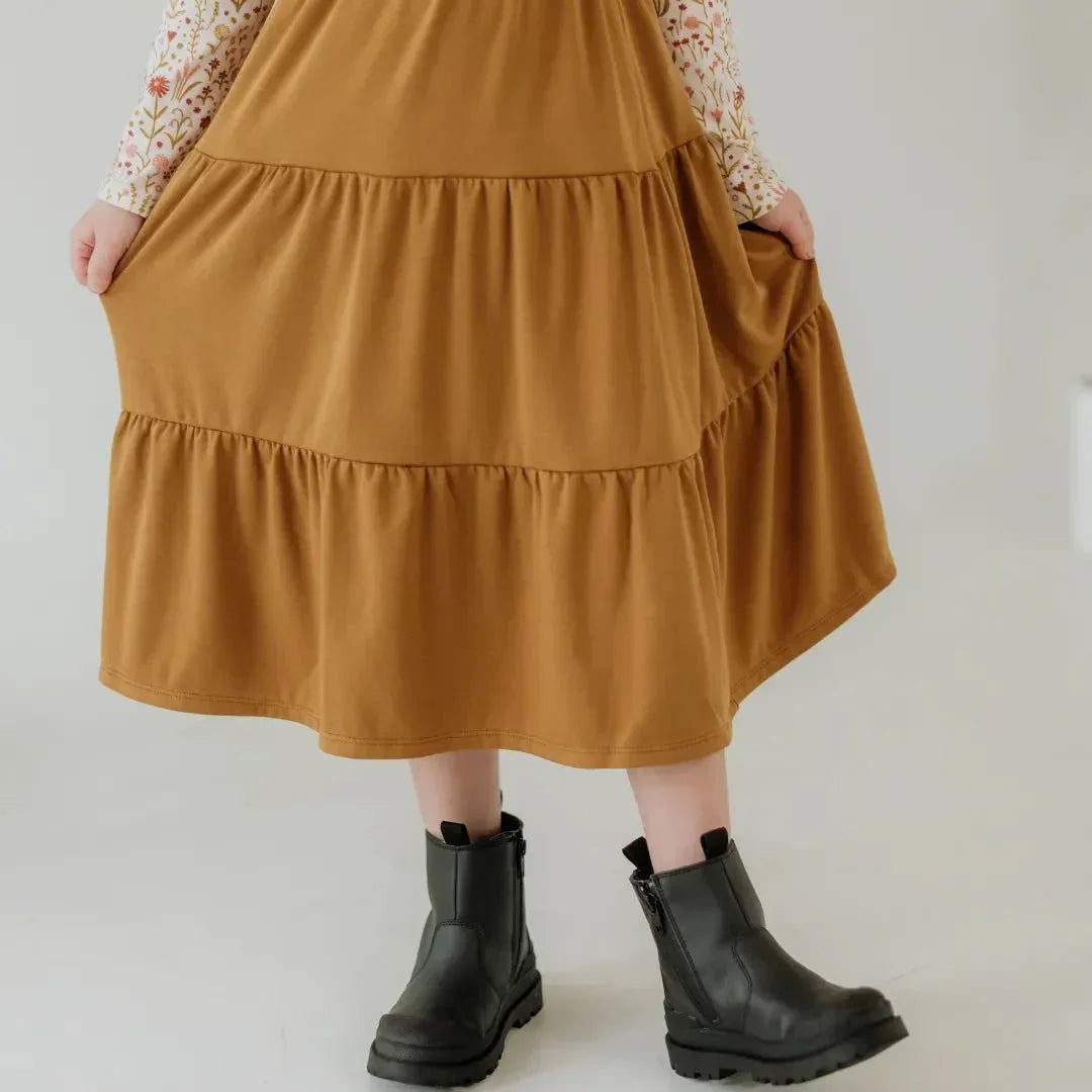 Youth bamboo tiered Aria skirt in tan, child wearing floral top and black boots