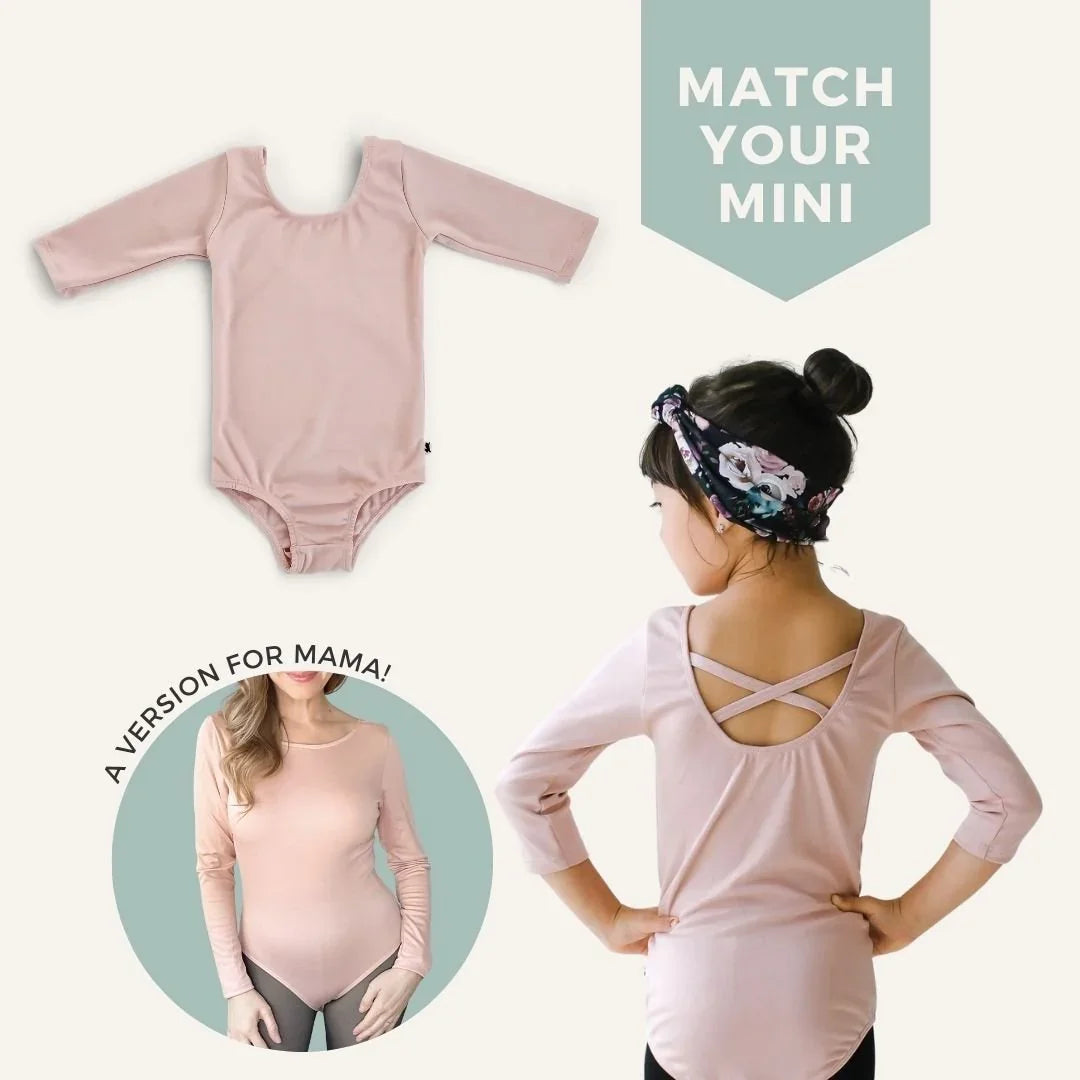 Ladies bamboo Audrey bodysuit in blush pink, shown on a child and adult, long sleeves, criss-cross back.