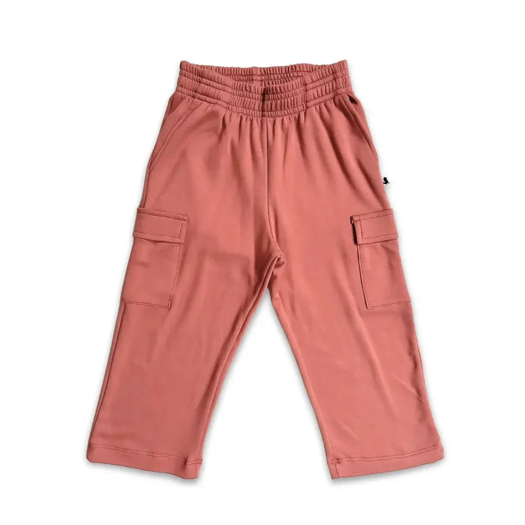 Pink youth bamboo cargo pants with side pockets on white background
