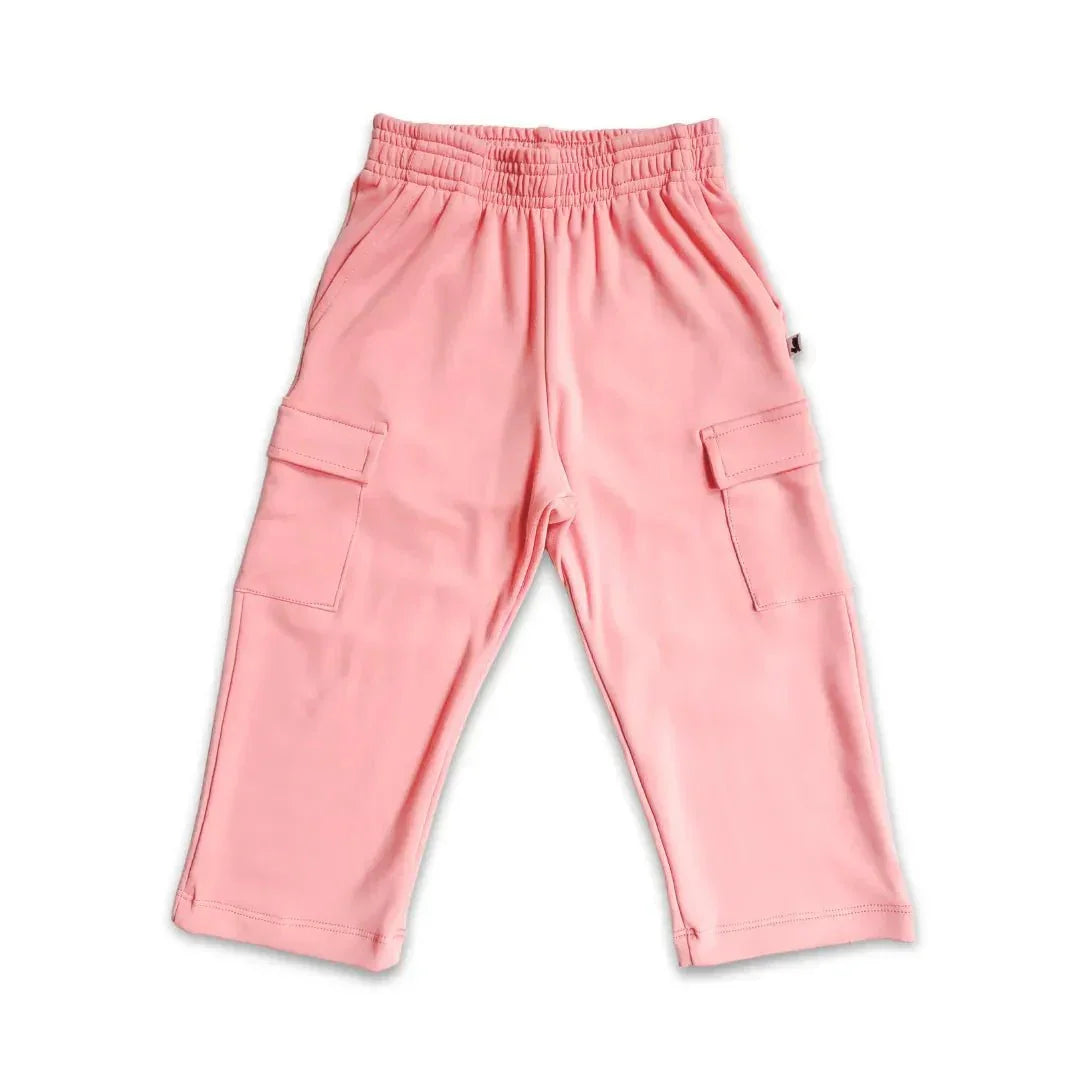 Pink youth bamboo cargo pants with elastic waistband and side pockets on white background