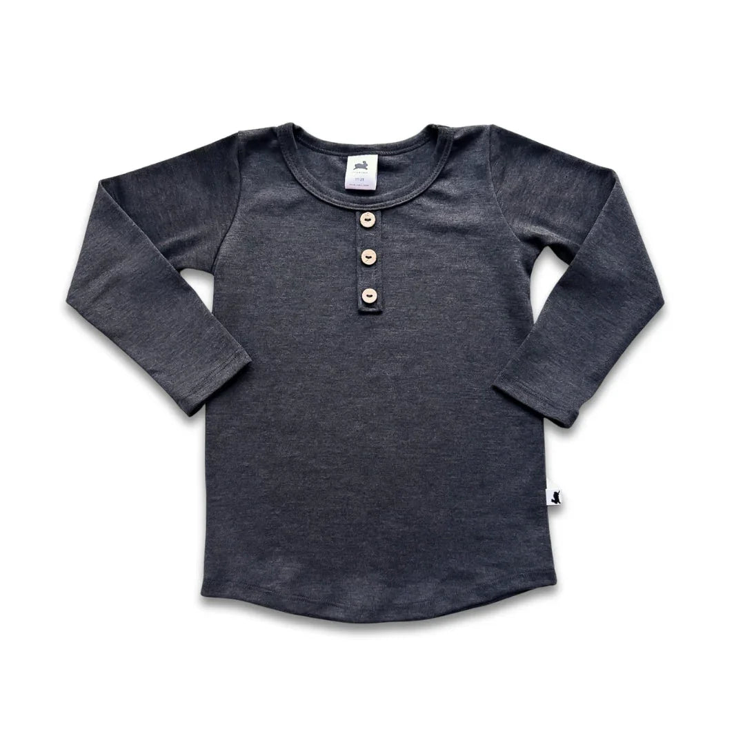 Dark grey youth bamboo Henley long sleeve shirt with three buttons, laid flat on white background