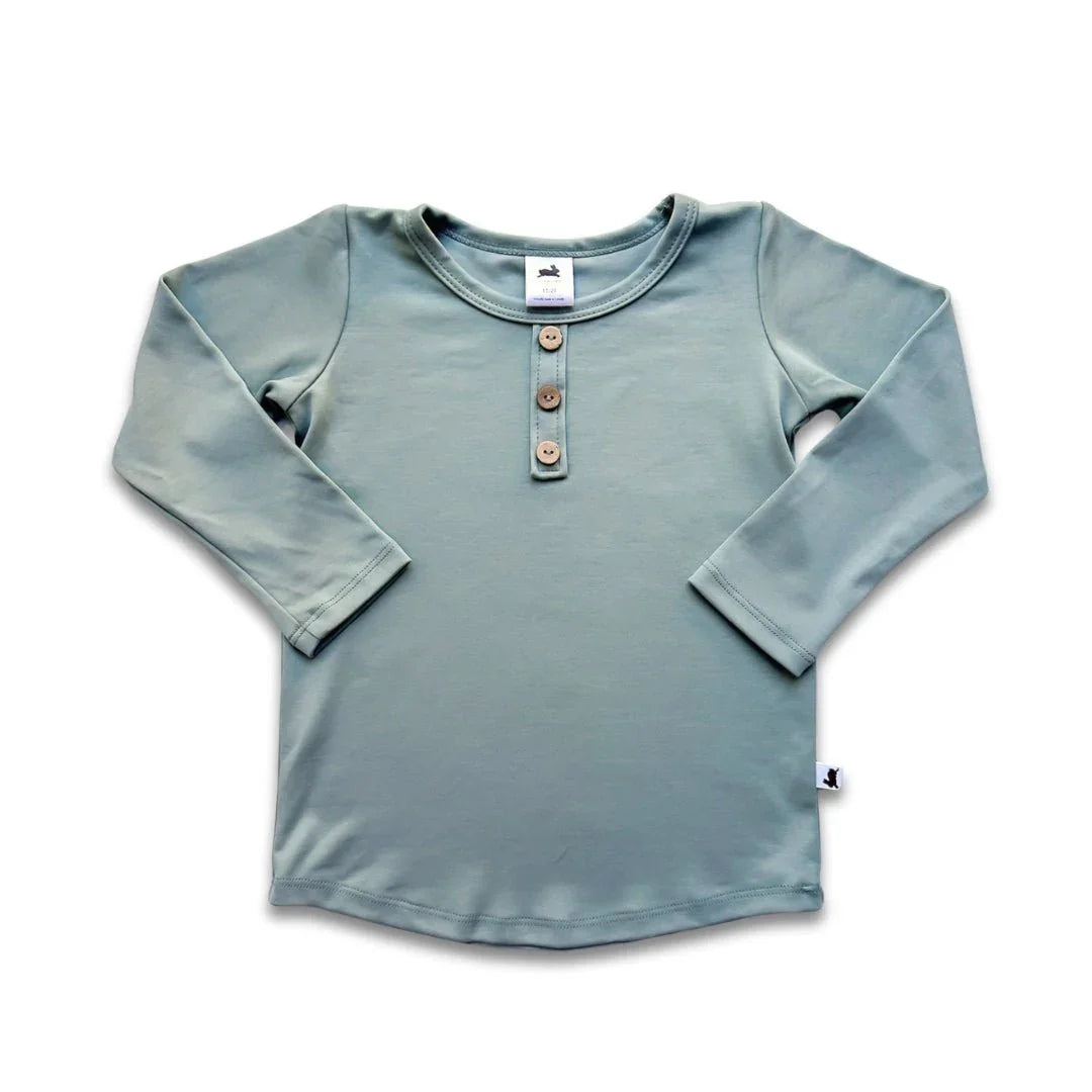 Youth bamboo Henley long sleeve shirt in light teal with wooden buttons, flat lay