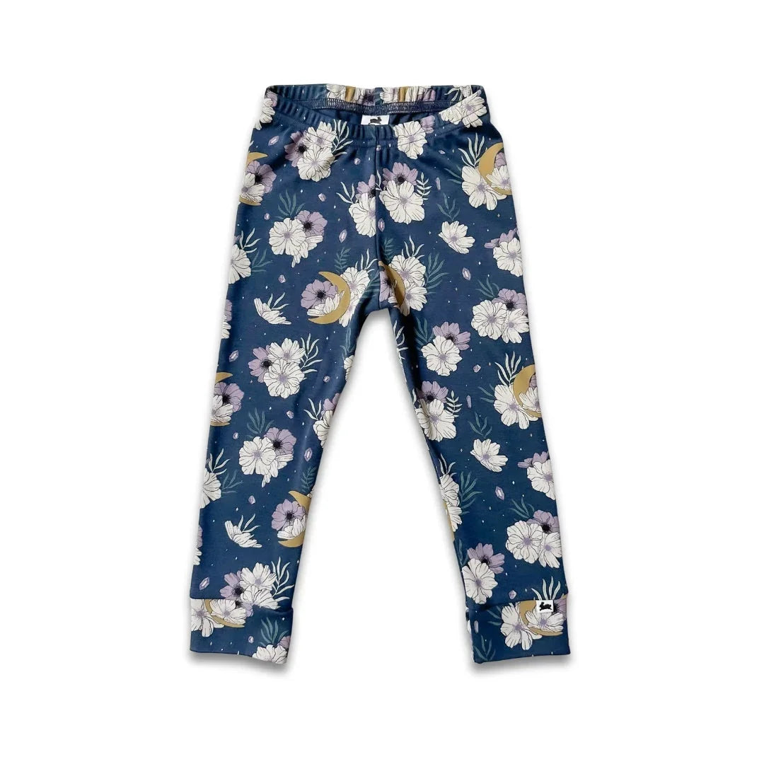 Blue floral kids leggings with white and purple flowers and moon patterns