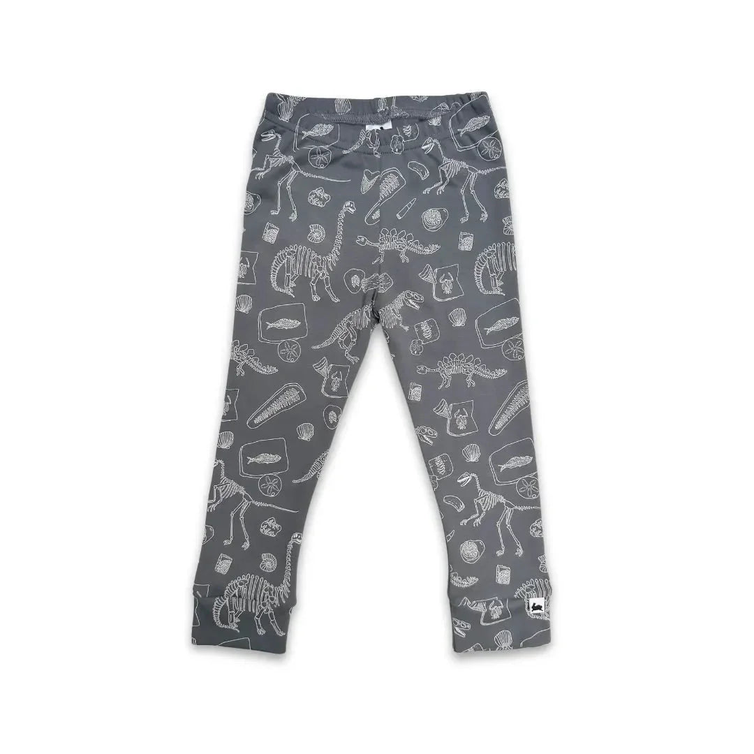 Gray youth bamboo leggings with white dinosaur fossil print, flat lay, Little & Lively