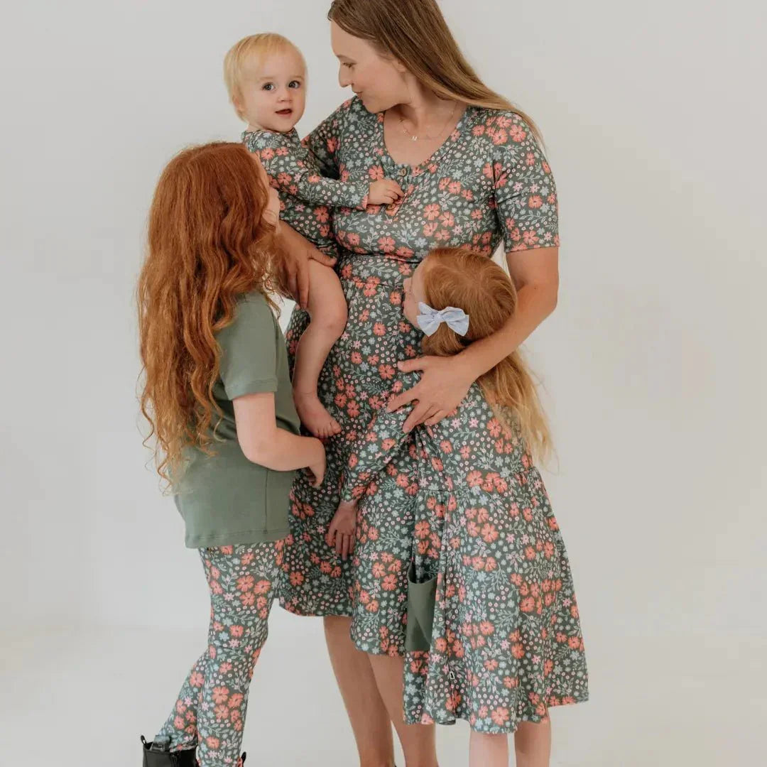 Family in matching floral bamboo leggings and dresses, Little & Lively FW24 collection