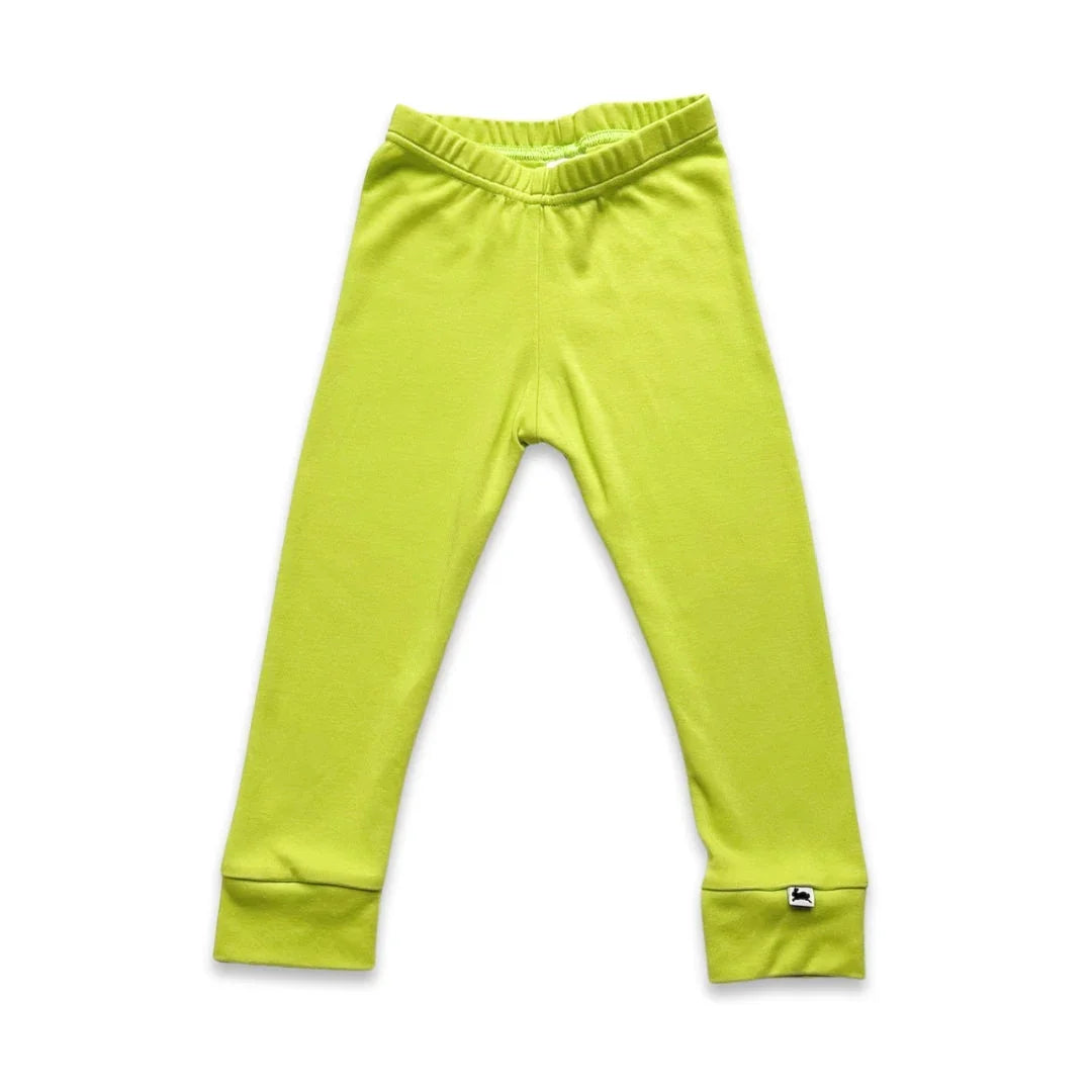 lime green kids cotton leggings with elastic waistband and cuffed ankles on white background