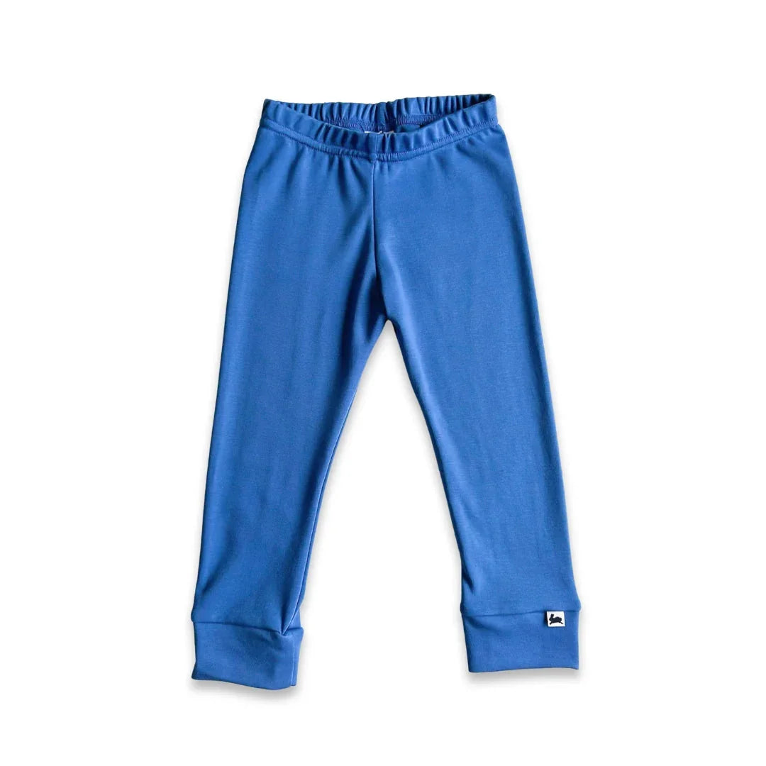 Blue organic cotton kids leggings with elastic waistband on white background