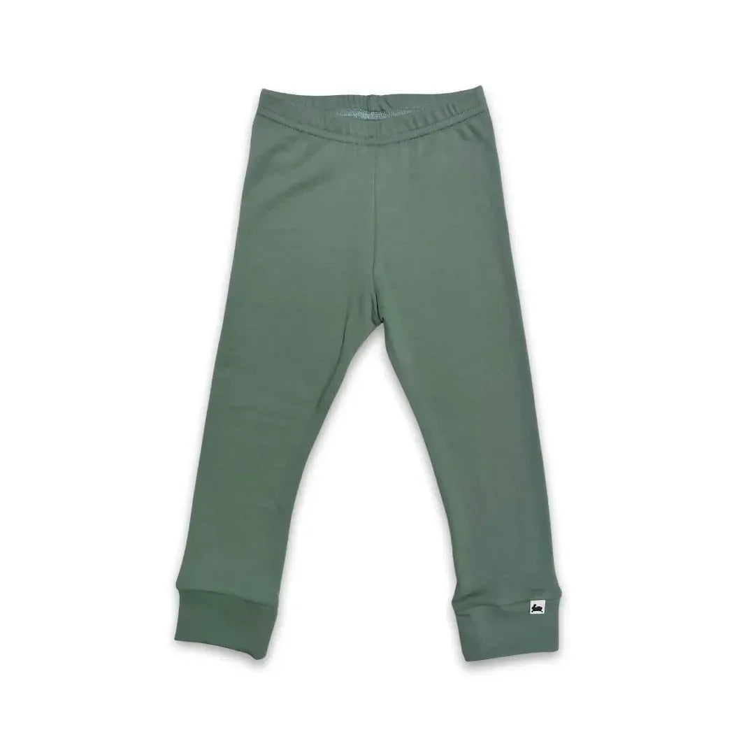 Youth bamboo leggings in solid green color with cuffed ankles on a white background