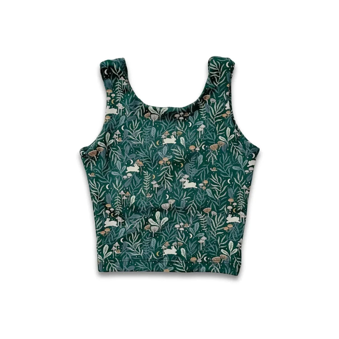 Green crop tank top with woodland animal and mushroom print on white background