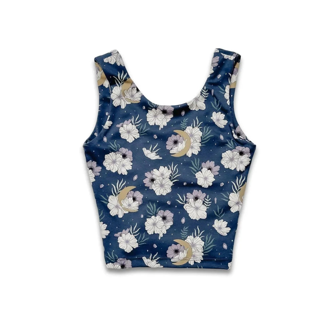 Blue floral crop top with moon and flower print on seamless background