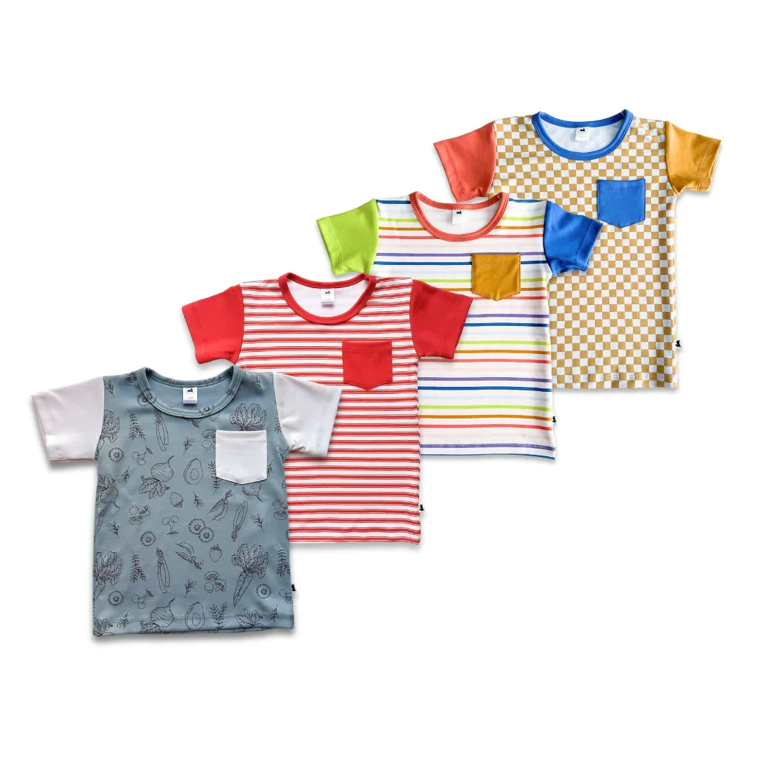 Assorted youth pocket tees with stripes, patterns, and colorful sleeves on white background