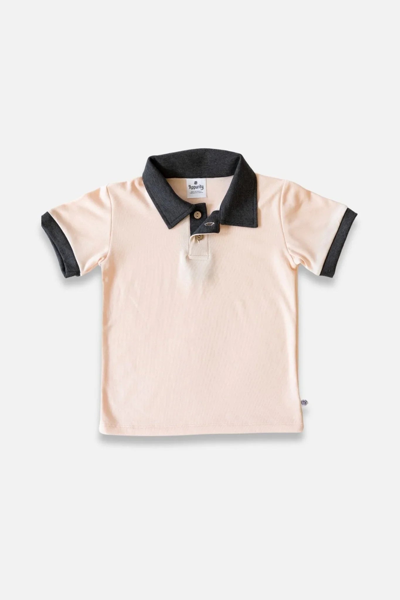 Youth bamboo polo shirt with short sleeves, light pink body, and dark collar, flat lay
