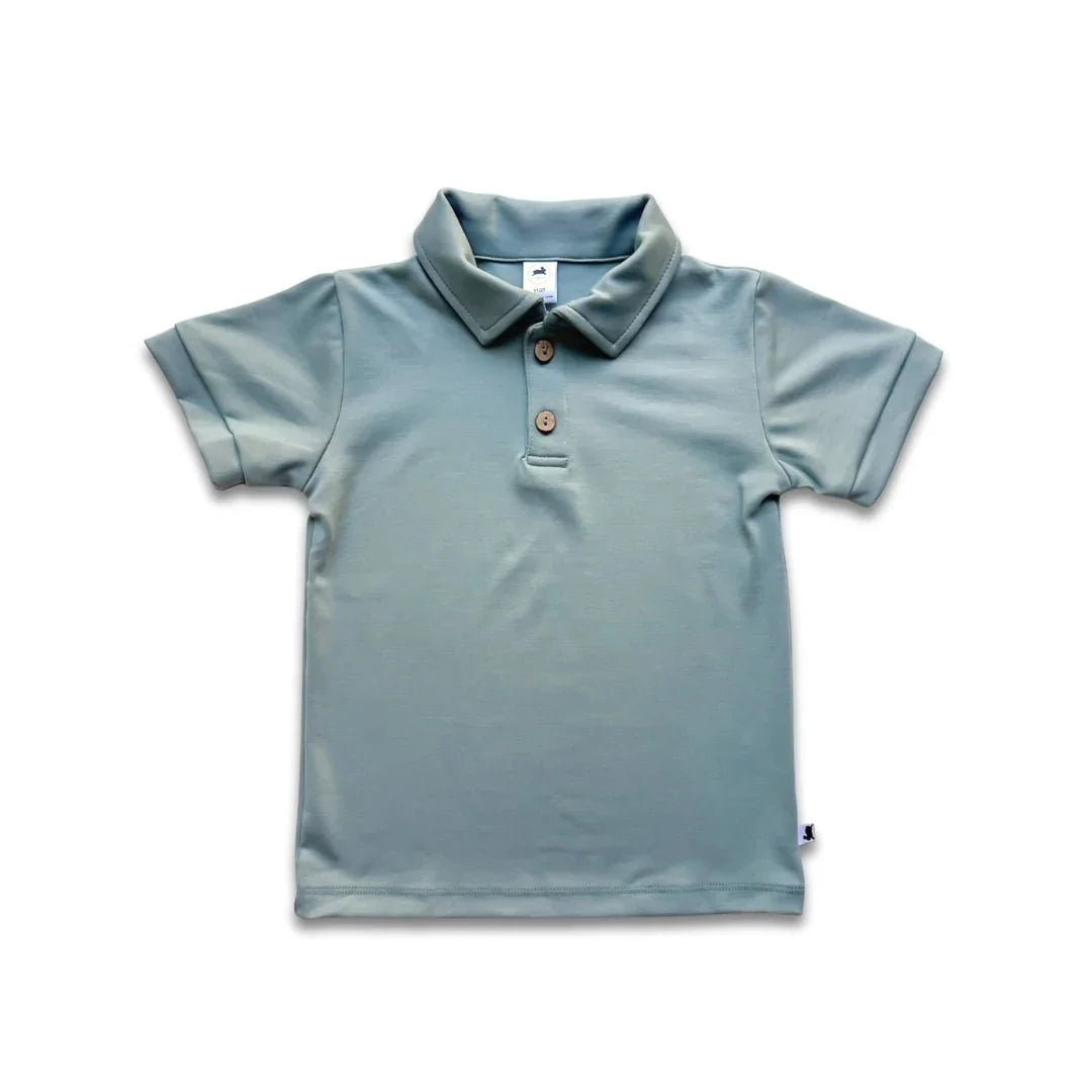 Light blue youth bamboo polo shirt with short sleeves and wooden buttons on white background