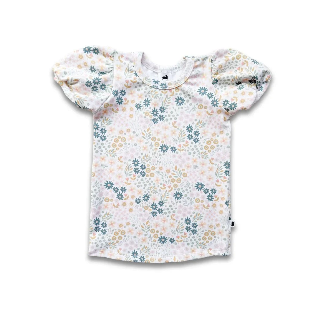 Youth bamboo puffed sleeve t-shirt with pastel floral print, laid flat on white background