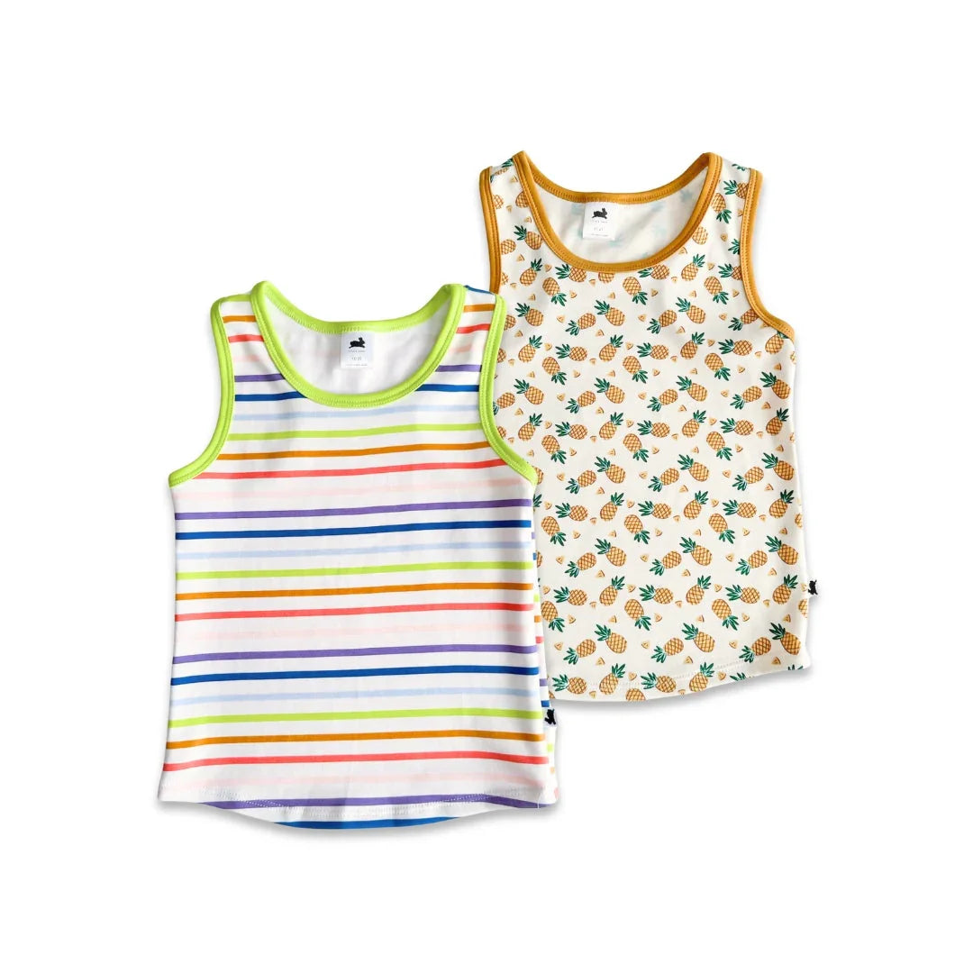Kids tank tops, one with colorful stripes and one with pineapple print, on white background