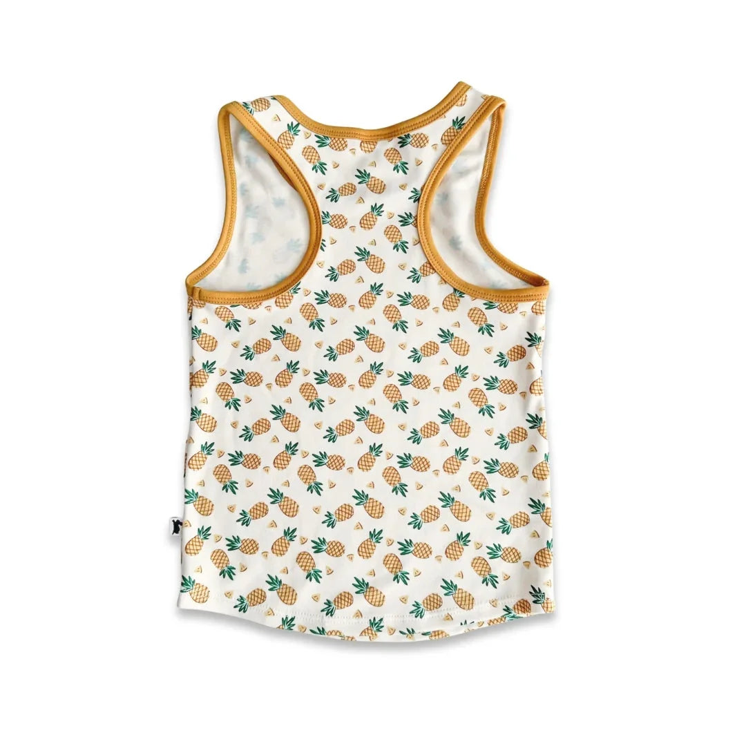 White tank top with yellow trim and pineapple pattern, laid flat on a white background