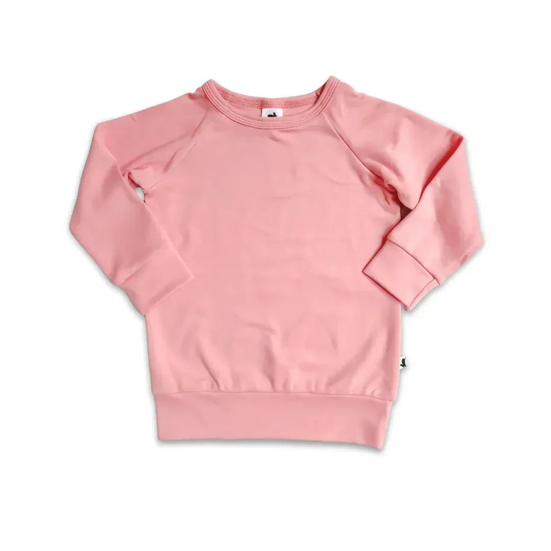 Pink bamboo youth raglan pullover sweatshirt solid color on white background