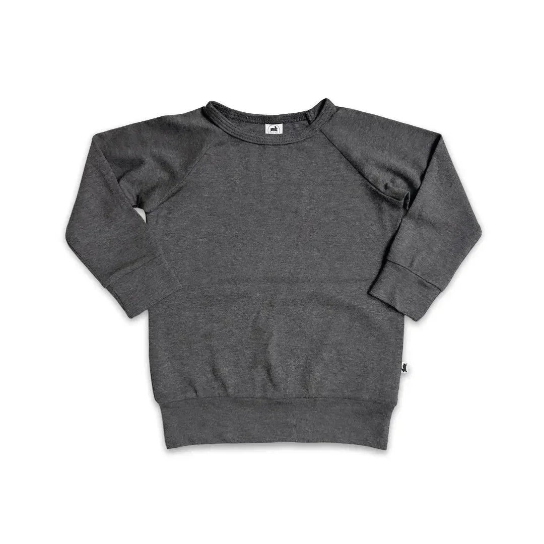 Youth bamboo raglan pullover in solid dark grey, long sleeves, crew neck, flat lay.