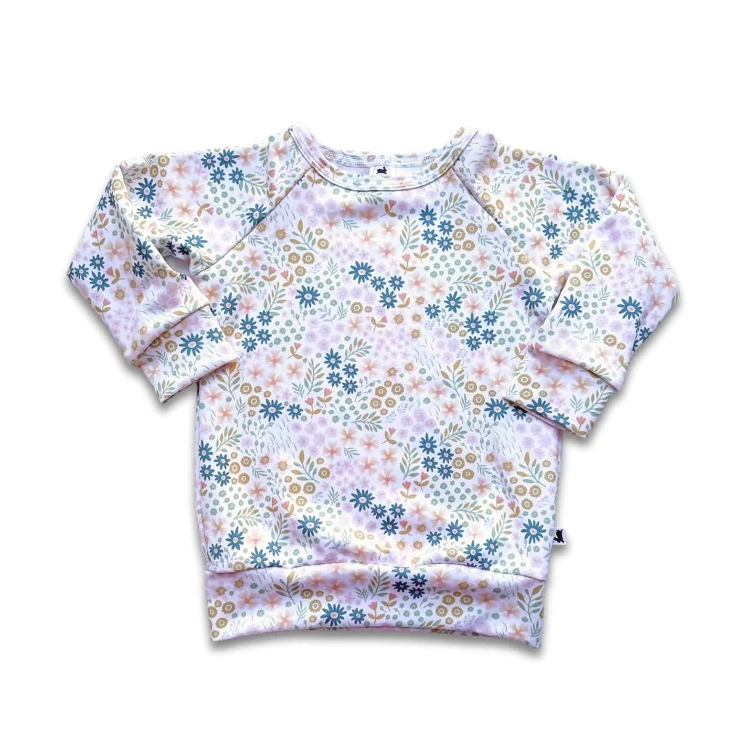 Youth bamboo raglan pullover with colorful floral print on white background