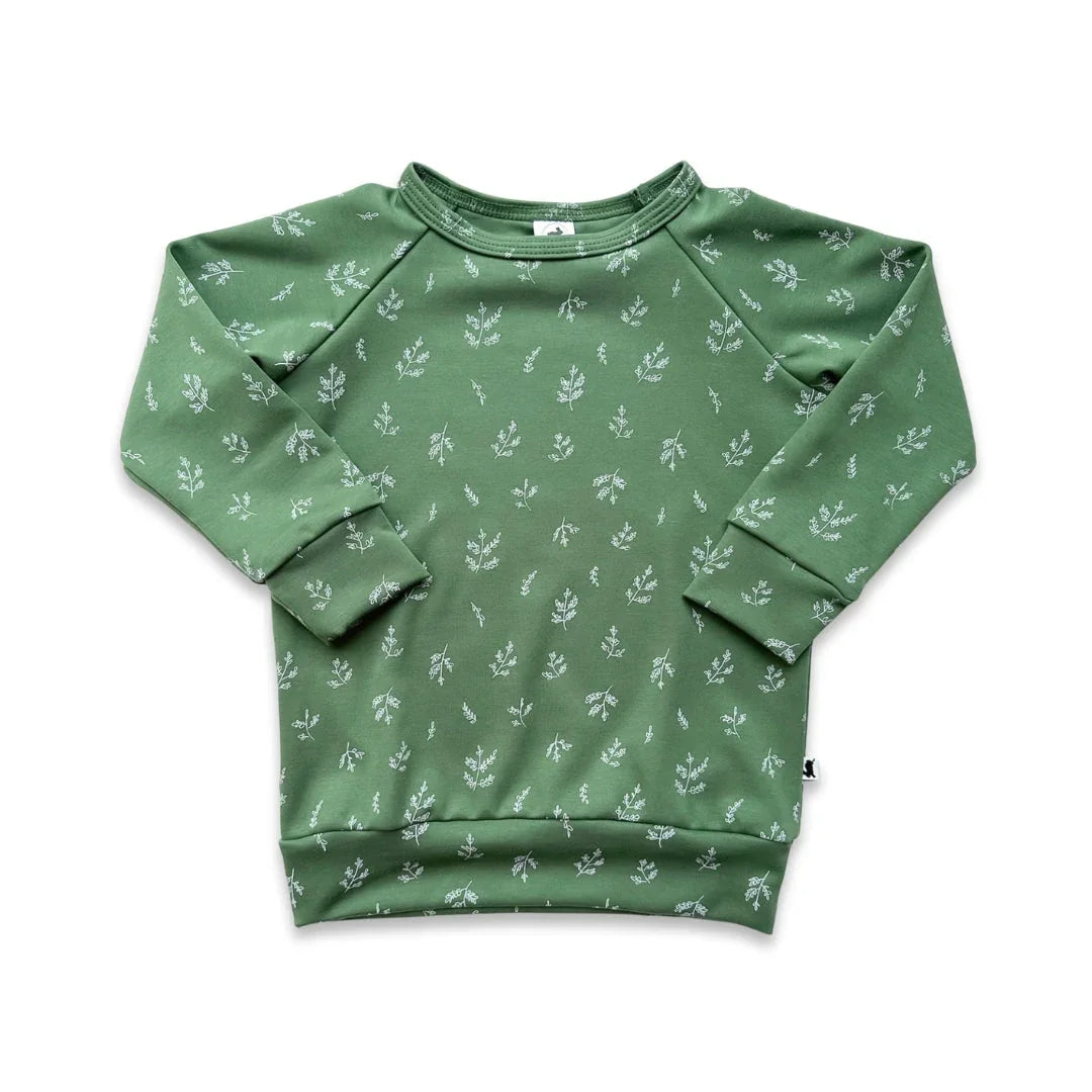 Green kids sweatshirt with white botanical print, long sleeves, and crew neck
