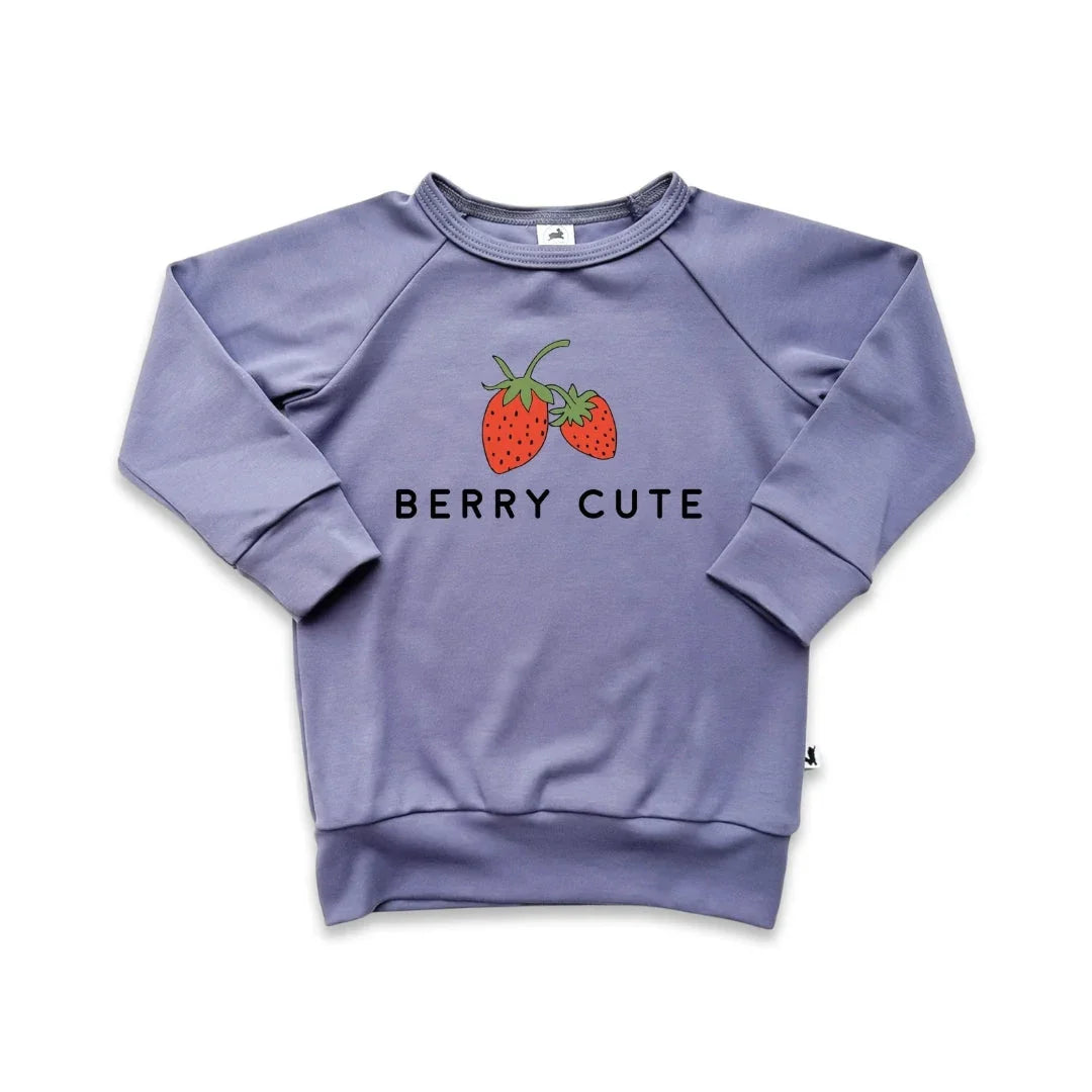 Purple kids sweatshirt with strawberries and 'Berry Cute' text graphic on front.